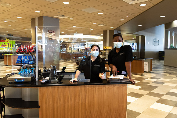 Student employees working at the Crossroads with masks on during the Covid-19 Pandemic.