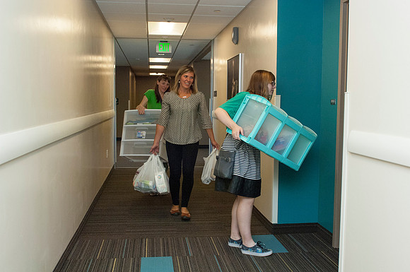 Parents help their student move into her new apartment at Centre Square.