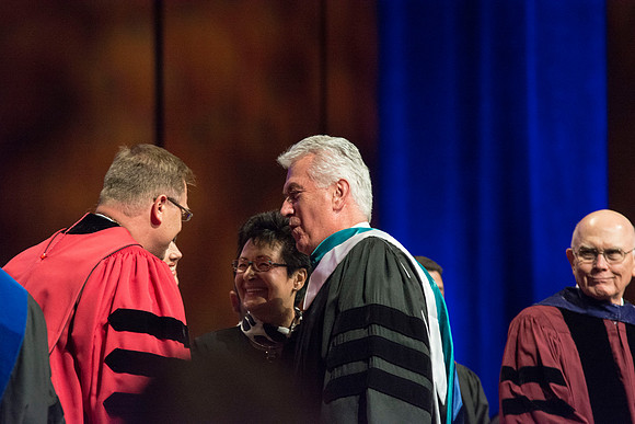 A quite moment shared during the recessional. Photo by Erik Hill.