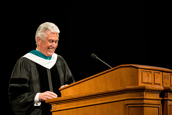 President Uchtdorf laughs after his wife fixed his robes.
