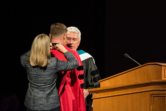 President Uchtdorf installs President Gilbert as the President of Brigham Young University-Idaho, and with Sister Gilberts help presents him with his medallion.
