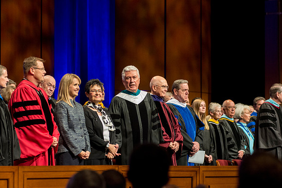 Elder and Sister Bednar, President and Sister Clark, President and Sister Uchtdorf, Elder Oaks, and Elder Holland on the stand during the Processional.