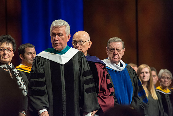 President and Sister Uchtdorf, Elder Oaks, and Elder Holland on the stand.