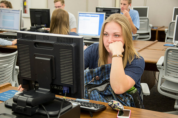 Students work on their homework in the McKay Library on the first day of school.