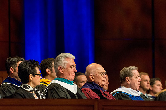 Sister Uchtdorf, President Uchtdorf, Elder Oaks and Elder Holland on the stand.