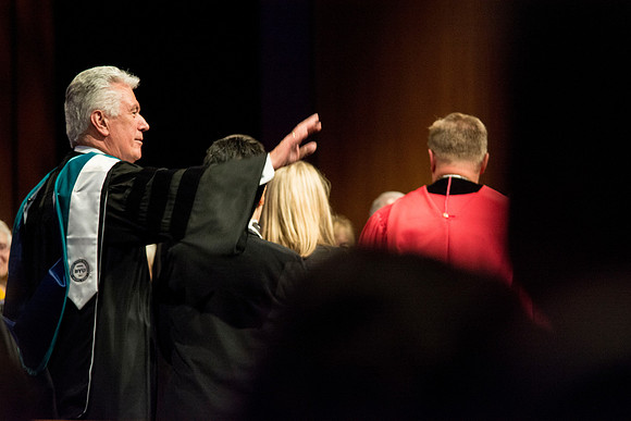 President Dieter F. Uchtdorf waves goodbye.