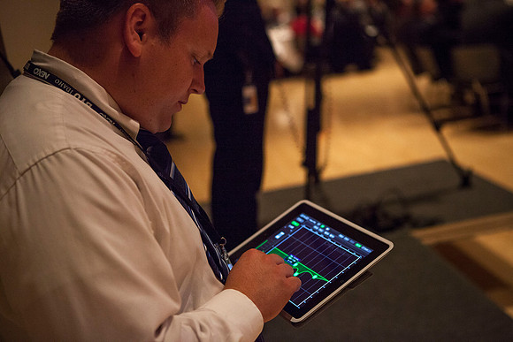 The AV Department works in the back of the MC Ballroom during the Inaugural Luncheon.
