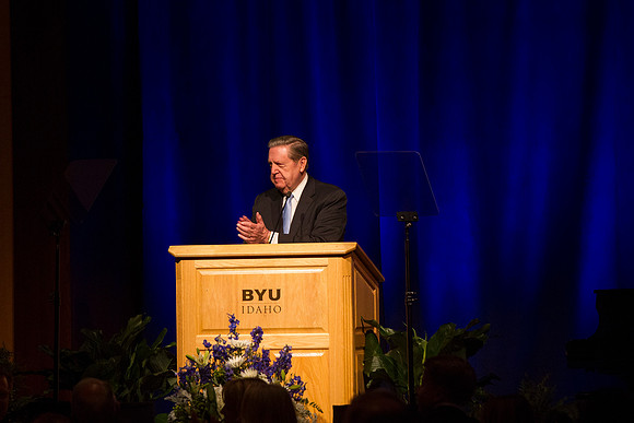Elder Holland applauds the Gilbert's during the Inaugural Luncheon.