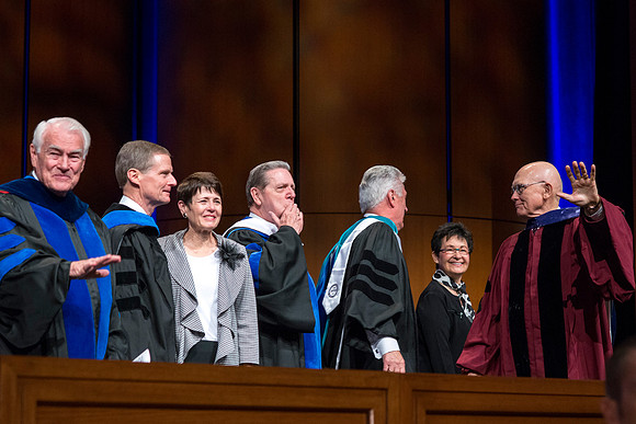 Recessional: Elder Holland and Elder Oaks acknowledge the audience.