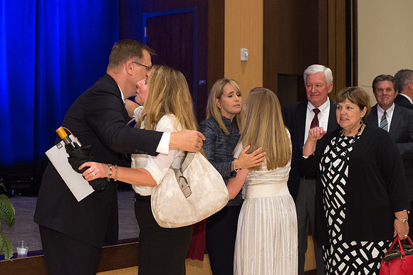Guests, familiy and friends congratulate President and Sister Gilbert after the Inauguration Ceremony.