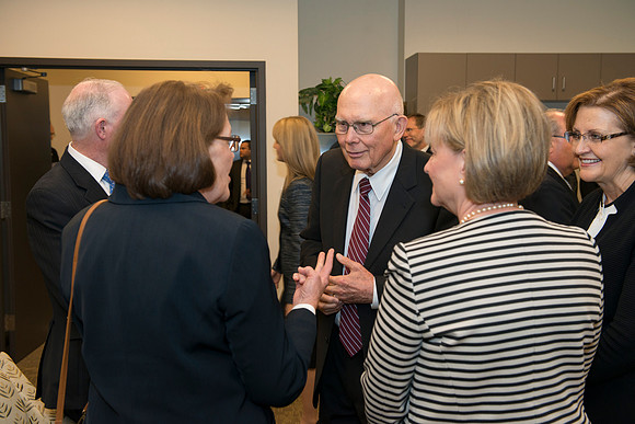Elder Oaks visits with Sister Clark, Oscarson and Burton.