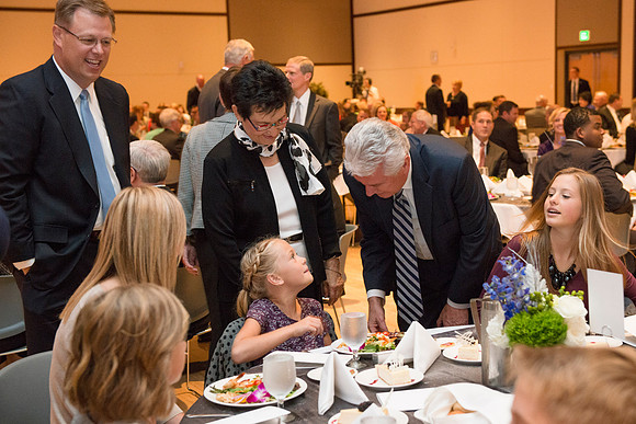 Inauguration luncheon in the Manwaring Center Grand Ballroom. President Uchtdorf greets members of President Gilbert's family.