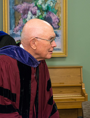 Elder Oaks looks on as the past presidents of Ricks college and BYU-Idaho gather for a picture.
