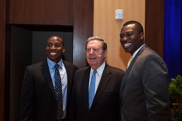 Elder Holland takes a picture with some friends during the Inaugural Luncheon.