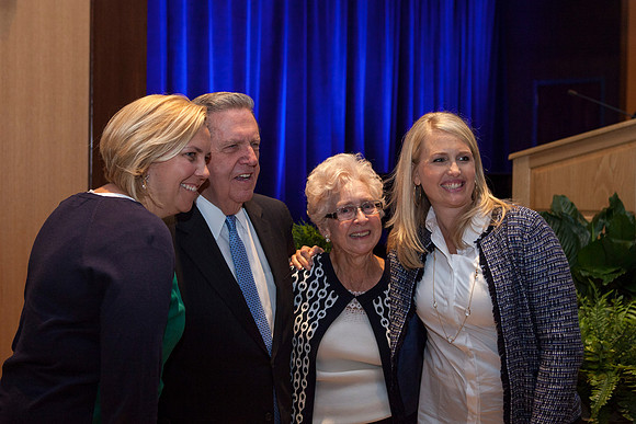 Elder Holland takes a picture with some friends during the Inaugural Luncheon.