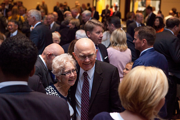 Elder Dallin H. Oaks converses with some friends during the Inaugural Luncheon.