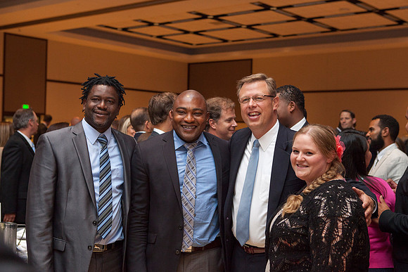 President Clark G. Gilbert takes a picture with some friends after the Inaugural Luncheon.