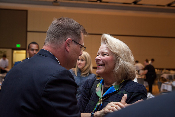 President Clark G. Gilbert converses with a friend after the Inaugural Luncheon.