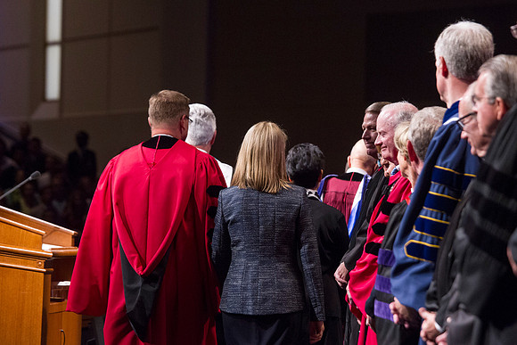 President Clark G. Gilbert walks on stage with is wife Christine, at the commencement of his Inauguration.