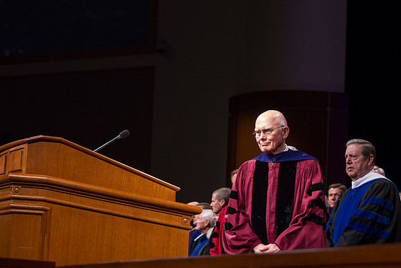 Elder Dallin H. Oaks walks up to the podium to conduct the Inaugural Program.