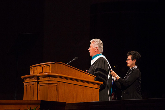 Sister Uchtdorf makes sure that her husband looks squared away during the Inauguration.