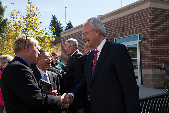 Architect Jim Lewis greets Elder Hamula.