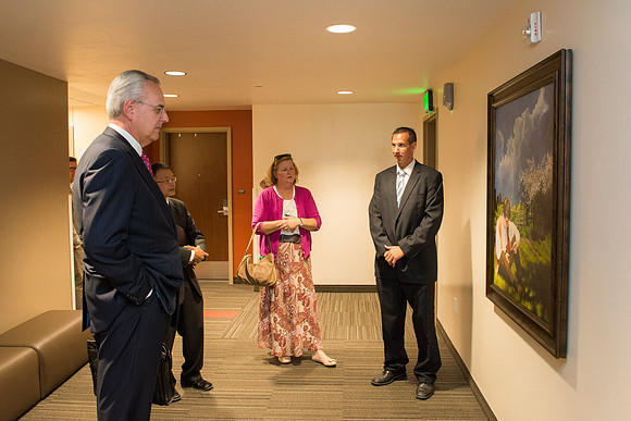 Elder and Sister Hamula take a tour of Centre Square and admire some of the Church History art work done by artist Al Rounds.