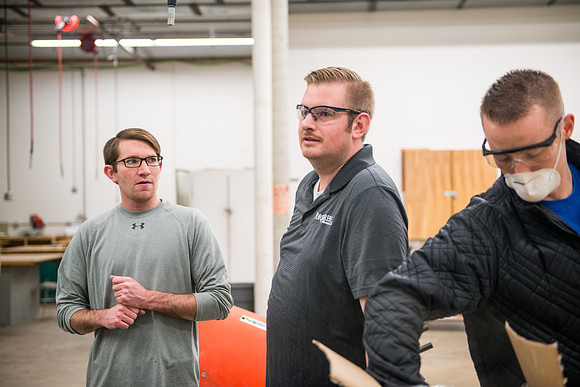 Civil engineering students work with different mixtures of cement to make a light, yet durable, cement that will be the building material for a canoe.