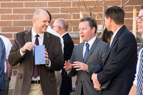 People gather before the dedication of the Center Square Apartments.