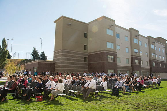 Elder James J. Hamula, of the First Quorum of the Seventy speaks, dedicates the new Center Square apartments.