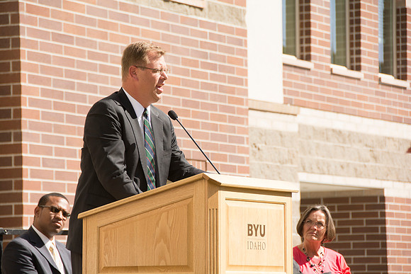 President Gilbert gives remarks at the dedication of the Center Square Apartments.