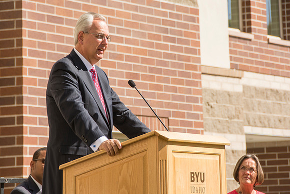 Elder James J. Hamula, of the First Quorum of the Seventy speaks, dedicates the new Center Square apartments.