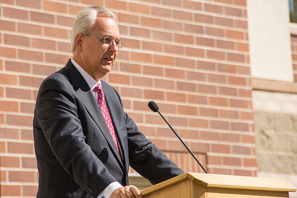 Elder James J. Hamula, of the First Quorum of the Seventy speaks, dedicates the new Center Square apartments.