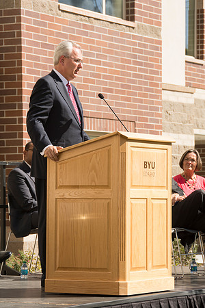 Elder James J. Hamula, of the First Quorum of the Seventy speaks, dedicates the new Center Square apartments.