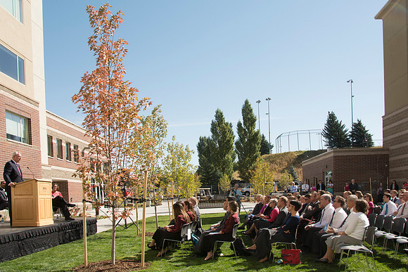 Elder James J. Hamula, of the First Quorum of the Seventy speaks, dedicates the new Center Square apartments.