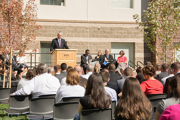 Elder James J. Hamula, of the First Quorum of the Seventy speaks, dedicates the new Center Square apartments.