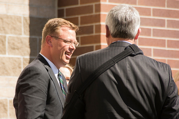 Elder James J. Hamula, of the First Quorum of the Seventy speaks, dedicates the new Center Square apartments.