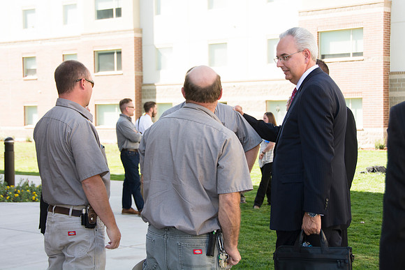 Elder James J. Hamula, of the First Quorum of the Seventy speaks, dedicates the new Center Square apartments.