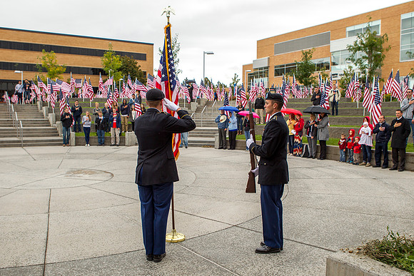 Cadet Fackrell and Cadet Larsen salute the American Flag during the Constitution Day Ceremony.