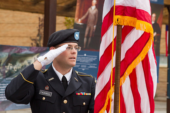 Cadet Fackrell salutes the American Flag during the Constitution Day Ceremony.