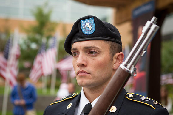Cadet Larsen honors the American Flag during the Constitution Day Ceremony.