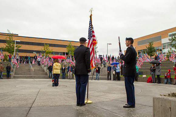 Cadet Fackrell and Larsen honor the American Flag during the Constitution Day Ceremony.