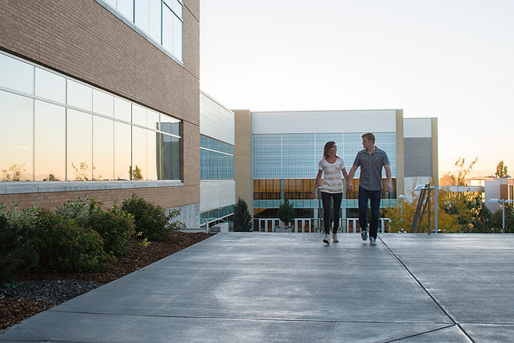 Taylor Welch and Ashley Howes enjoy a walk across campus.