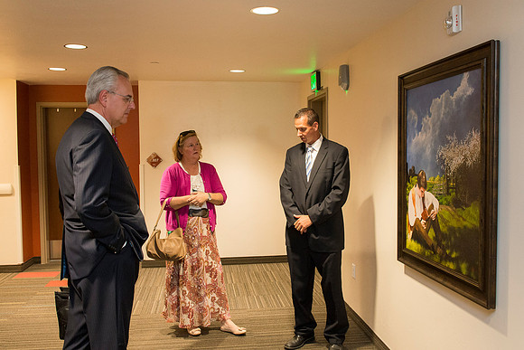Elder and Sister Hamula take a tour of Centre Square and admire some of the Church History art work done by artist Al Rounds.