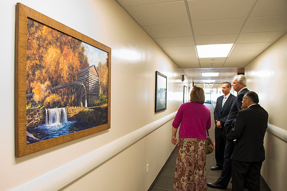 Elder and Sister Hamula take a tour of Centre Square and admire some of the Church History art work done by artist Al Rounds.