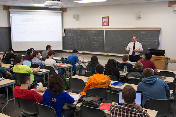 Brother Johanson answers a student's question during his Math 109 Precalculus class during the 2014 Spring Semester.