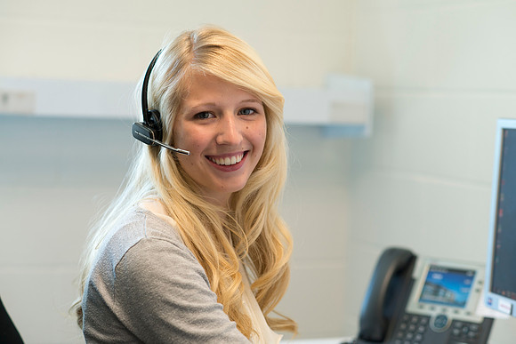Students help take calls in the Pathway Support Center.
