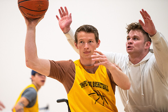 Students participate of Wheelchair Basketball in the Hart Gym.