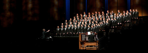 An all Mens Choir performs a musical number for Elder Allan F. Packer's Devotional in the BYU-Idaho Center.