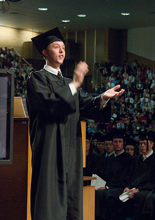 Music Dept grad, Brian Cook conducts the graduation choir.